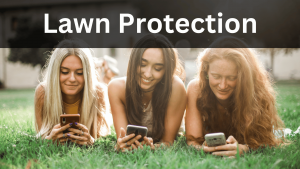 three girls laying on a lawn